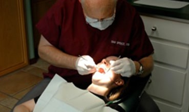 Abilene dentist Dr. Sam Spence treating his patient.